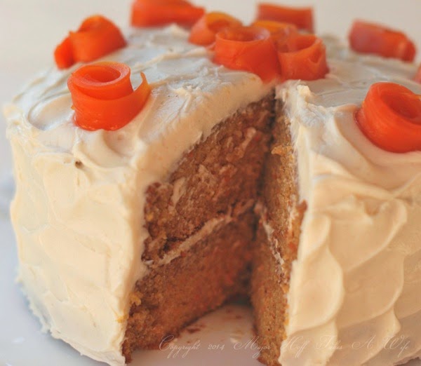 Carrot cake with rolled sugar carrot flowers