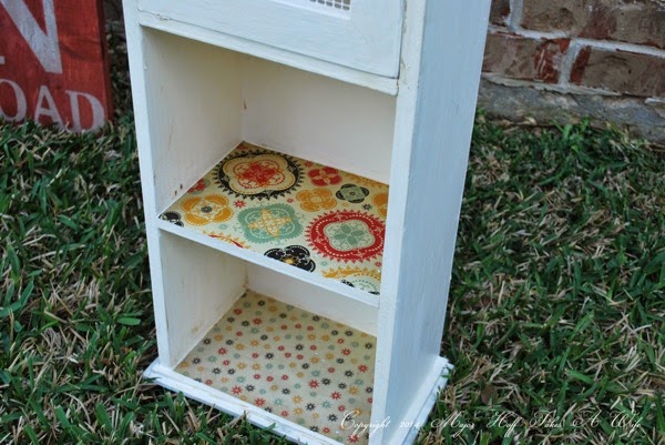 Decorate shelves with scrapbook paper and modge podge