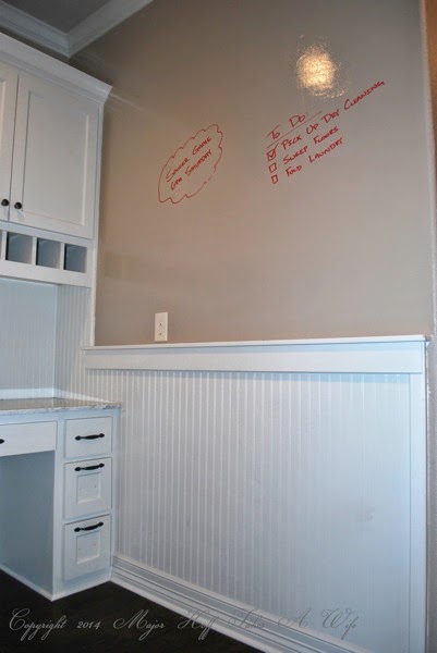 Mudroom beadboard wall with dry erase paint area above