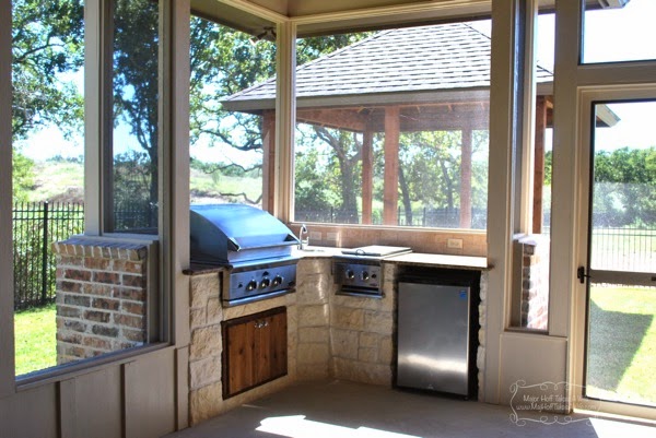 Outdoor screened in porch with bbq fridge and gazebo