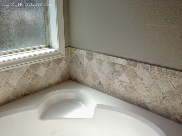 Tile surround on builder grade house in Texas