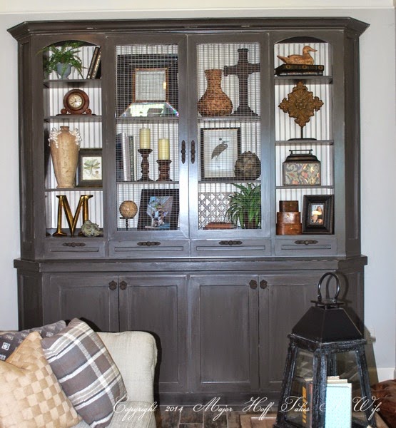 Custom built in living room cabinet with arched doors