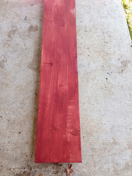 Lightly paint a plank of wood
