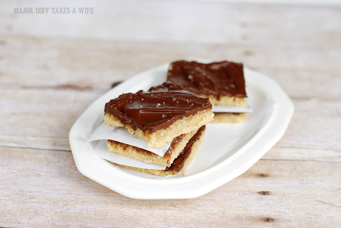 salted caramel shortbread squares on a white plate