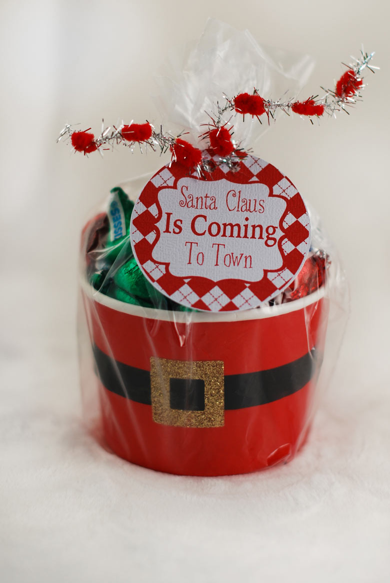 A santa belly gift cup filled with candy with a printable label to give to a friend or coworker