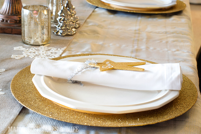 Gold White silver and mecury glass Christmas tablescape. A delightful Dining Room Holiday Tour. See how Mrs Major Hoff decorates for Christmas. The tour features table decorations, dining room decorating ideas, place settings and an idea for  homemade Christmas gift that can be personalized for your holiday guests. This post is part of the Home For The Holidays Blog Tour.