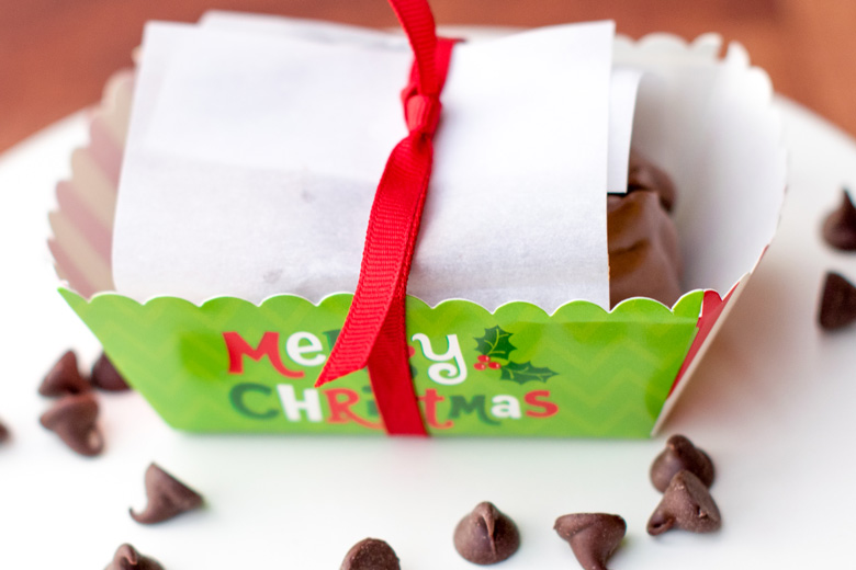 chocolate peanut clusters for gift giving wrapped up in a disposable Christmas paper mini loaf pan