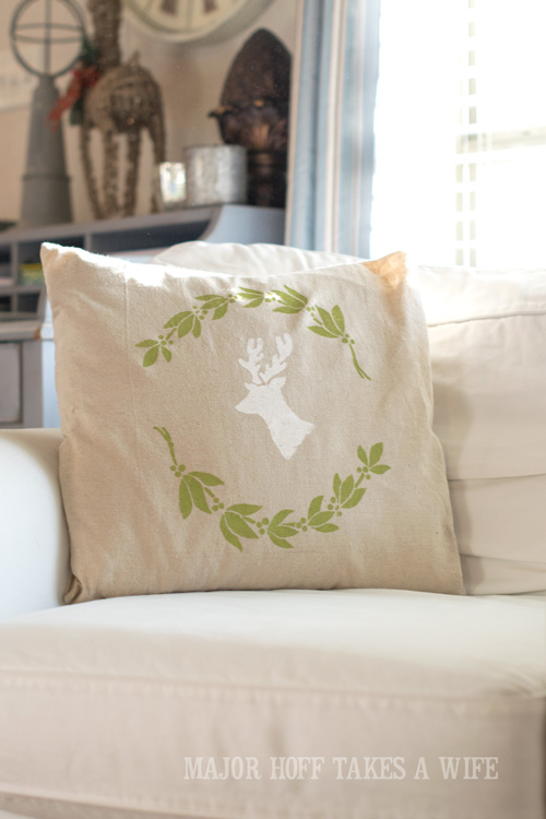 Use a blank pillow cover and stencils to make a holiday pillow. Looking for a way to bring Creativity into your Holiday Decor? Use easy to find items like pillow covers or dish towels, along with stencils to decorate your home for the Holidays. Enjoy crafting your own decorations this Christmas! #Christmas #Holidays #crafts #HolidayIdeas