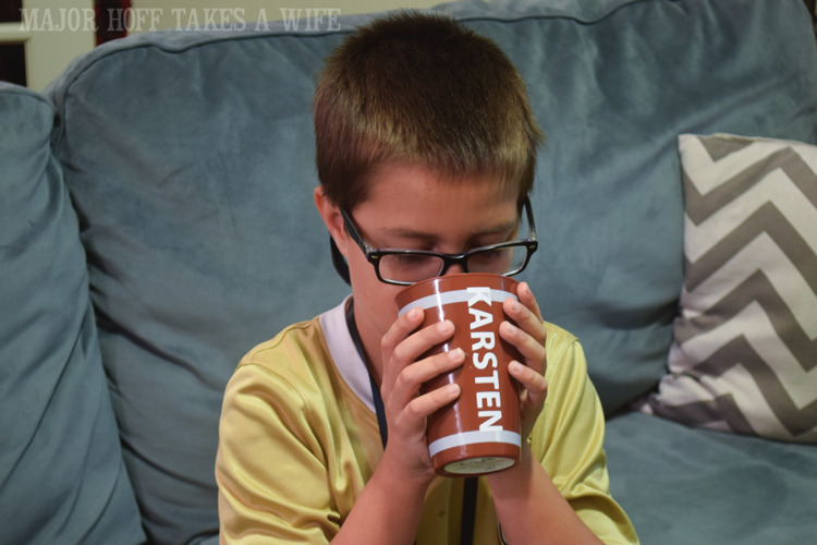 Personalized cups make the party more fun. Looking for a fun party for your teenage boy? Why not throw a Football video game party? Easy ideas for how to entertain kiddos during the Big Game. Features DiGiorno pizza, personalized football cups, free printable lanyards, and an incredible recipe for football shaped ice cream sandwiches! #GameTimeMVP #CollectiveBias #ad