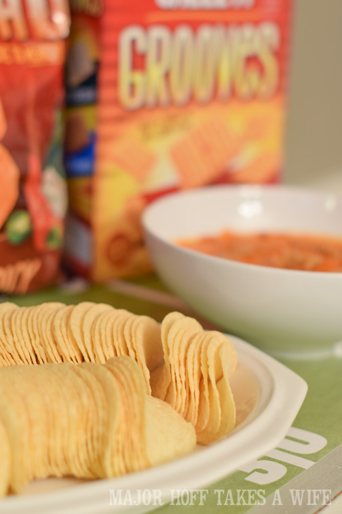 Pringles make a great party food. An easy to throw party for the Big Game. Features easy party ideas for snacks, dips and decor. Includes a recipe for Roasted Red Pepper Hummus without seeds! #BigGameSnacks #collectiveBias #ad 