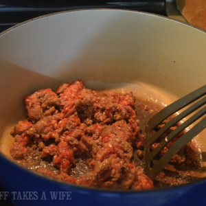 Saute Italian sausage in Le Creuset Pan for homemade marinara