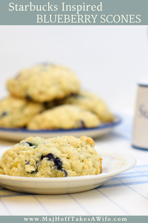 A melt in your mouth recipe for blueberry scones. Inspired by Starbucks in house version, this blueberry scone with hints of lemon and a crunchy sugary top will delight everyone. Serve during High Tea, or just as a mid afternoon snack. Perfect along side tea or coffee, or as a stand alone blueberry dessert. You won't believe how easy these are to make! Never made scones before? Never fear, this includes a step by step tutorial on how to make scones. #HighTea #blueberries #Starbucks #scones #dessert via @mrsmajorhoff
