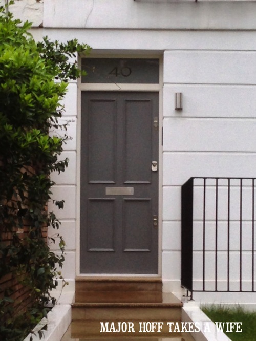 Replace classic black door color with gray. Looking for painting ideas? About to pick a front door color? Be inspired by these doors found in London. From classic to bold, there is sure to be a color that suits you! #color #inspiration #London #FrontDoor #paintingideas