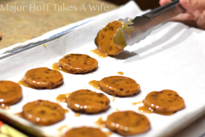 Allowing butterscotch dipped cookies to cool