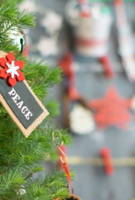 Small ornaments on a table top Christmas tree