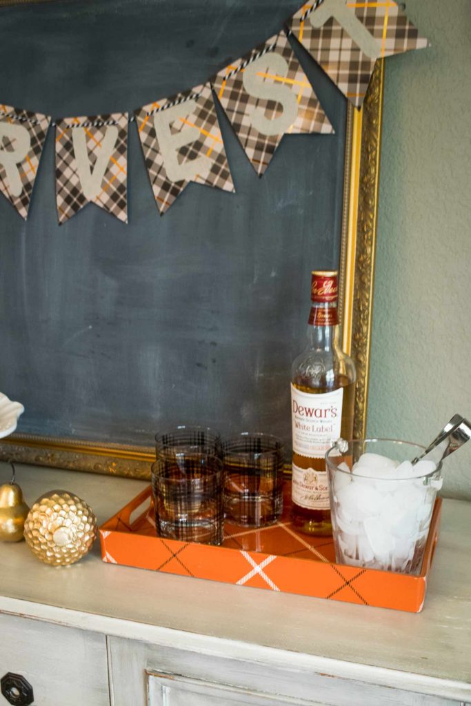whiskey glasses with Dewars scotch and a vintage glass ice holder for a golden thanksgiving set up