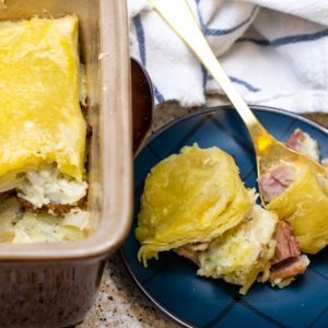 a casserole dish with ham cheese and potato pie casserole