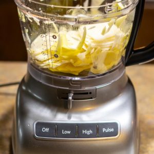 slicing potatoes into thin slices with a kitchenAid food processor