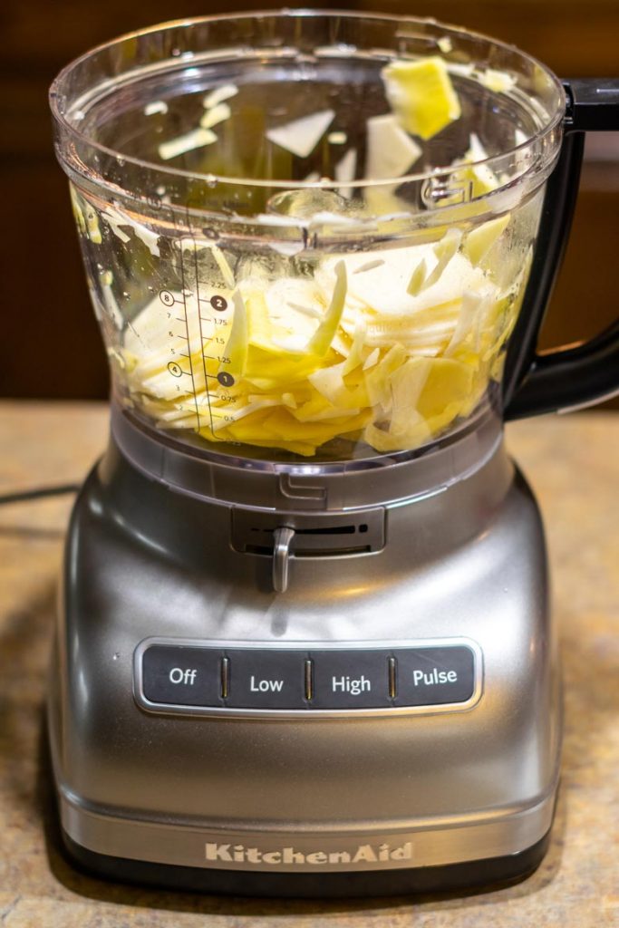 slicing potatoes into thin slices with a kitchenAid food processor