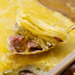 layers of ham potatoes and sauce for a quick weeknight comfort food dish