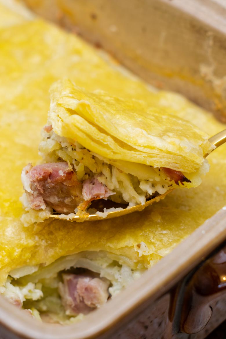 layers of ham potatoes and sauce for a quick weeknight comfort food dish