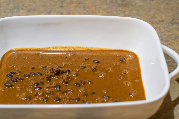 Enchilada sauce coating a pan