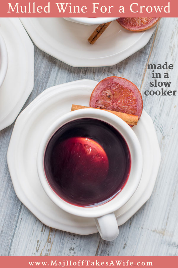 This winter mulled wine recipe is a cinch to make in a slow cooker. Featuring fresh oranges, apple slices and cinnamon it will be a crowd favorite! So grab your crockpot, follow the easy recipe and have this German inspired drink at your next holiday party! Perfect for fall all through Christmas! #mulledwine #Christmasdrinks #fallbeverages via @mrsmajorhoff
