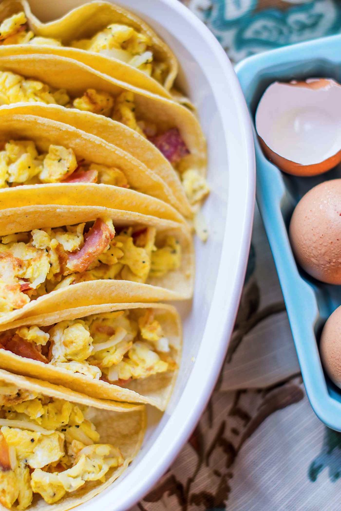 Breakfast Tacos For A Crowd! An easy way to feed a bunch at your next brunch! You'll love this mix of eggs, potatoes, bacon and cheese! So easy! via @mrsmajorhoff