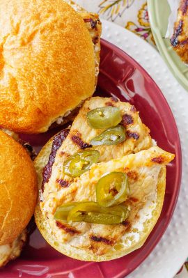 A spicy jalapeño cranberry jelly tops these grilled pork tenderloin sandwiches to make a fast and tasty weeknight meal in under 30 minutes!