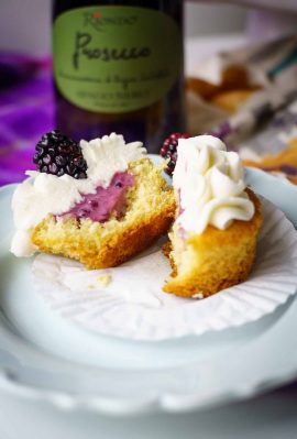vanilla prosecco cupcakes with prosecco icing and a blackberry filling