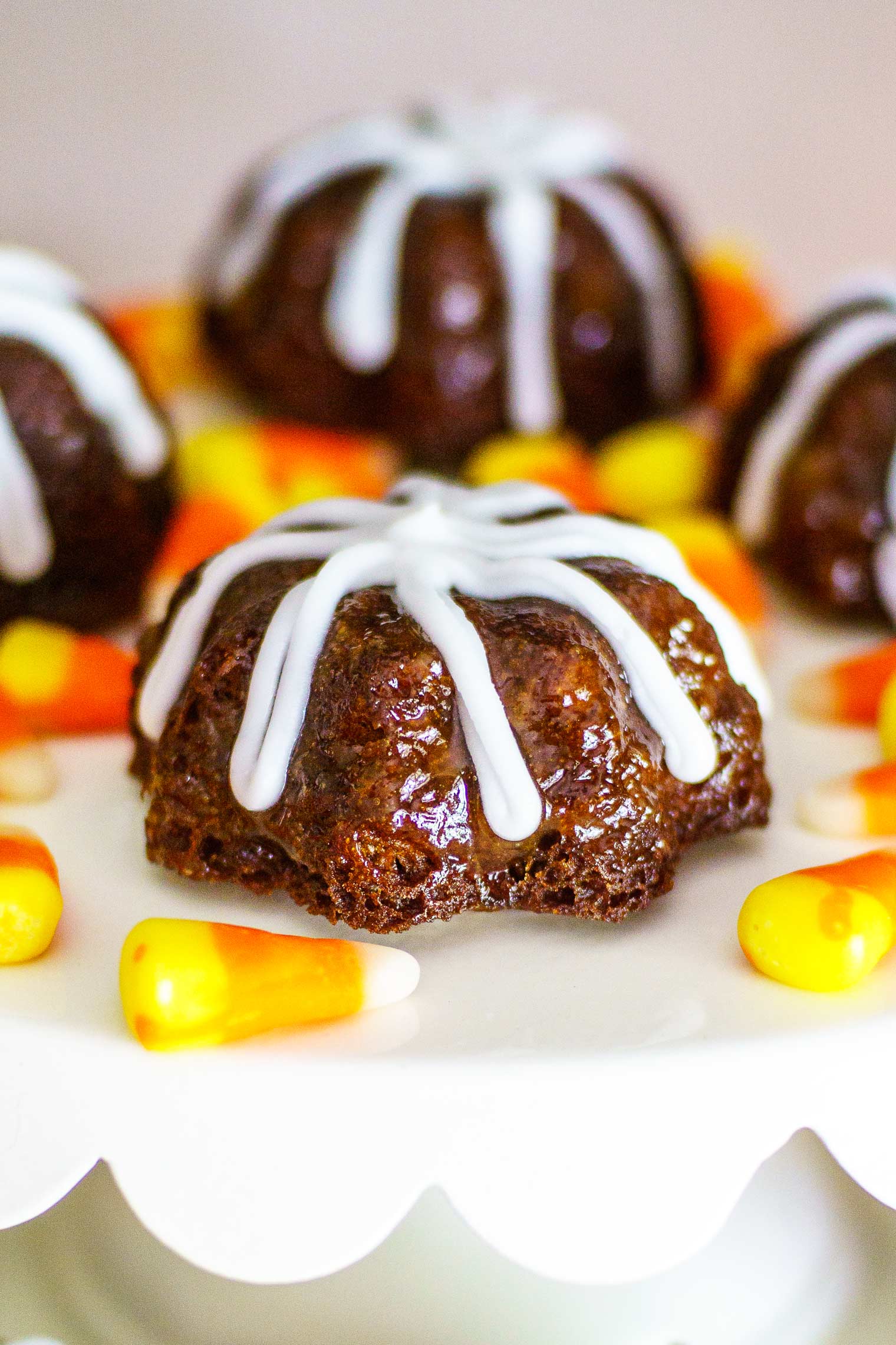 These sweet little gingerbread cakes are adorable and easy to make in a mini bundt pan. Perfect for all year round, these feature an optional peach glaze. @MrsMajorHoff for @worldmarket #worldmarket #ad #worldmarkettribe #WMHalloween