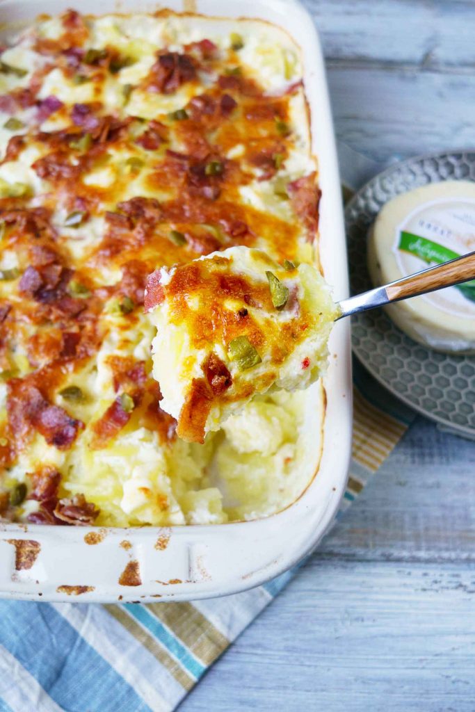 Scalloped potatoes with bacon and jalapenos adds a spicy twist on your favorite creamy and cheesy dish. Features jack cheese, cream cheese, bacon and more!