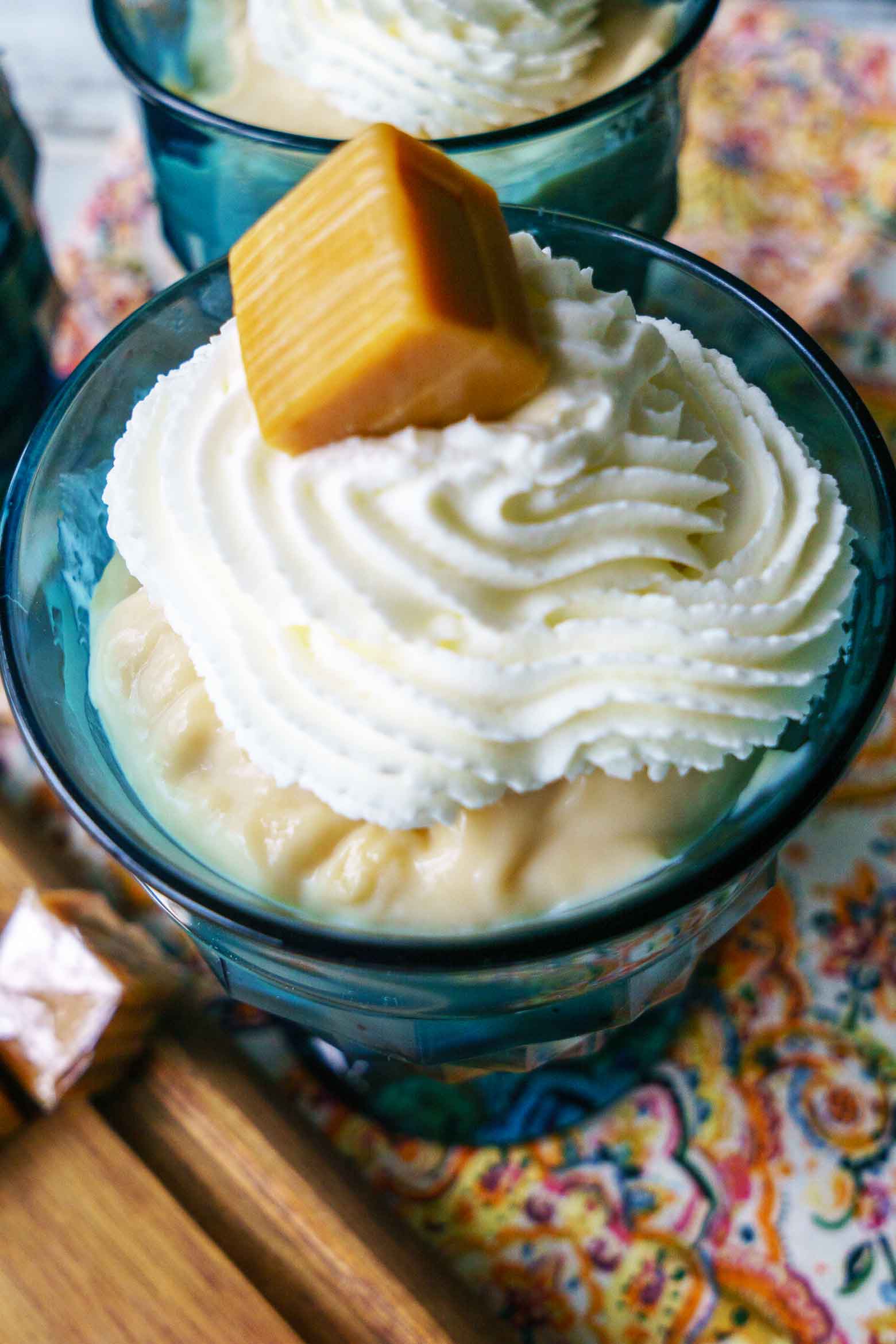 caramel pudding with whipped cream and caramel candy piece