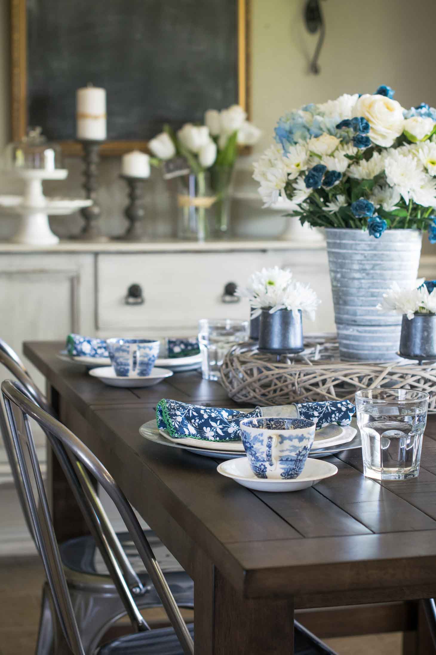 This blue and white china spring tablescape is sure to wow your guests on Easter and beyond. It utilizes antique blue and white antique ironstone as well as modern napkins and a fresh floral centerpiece.