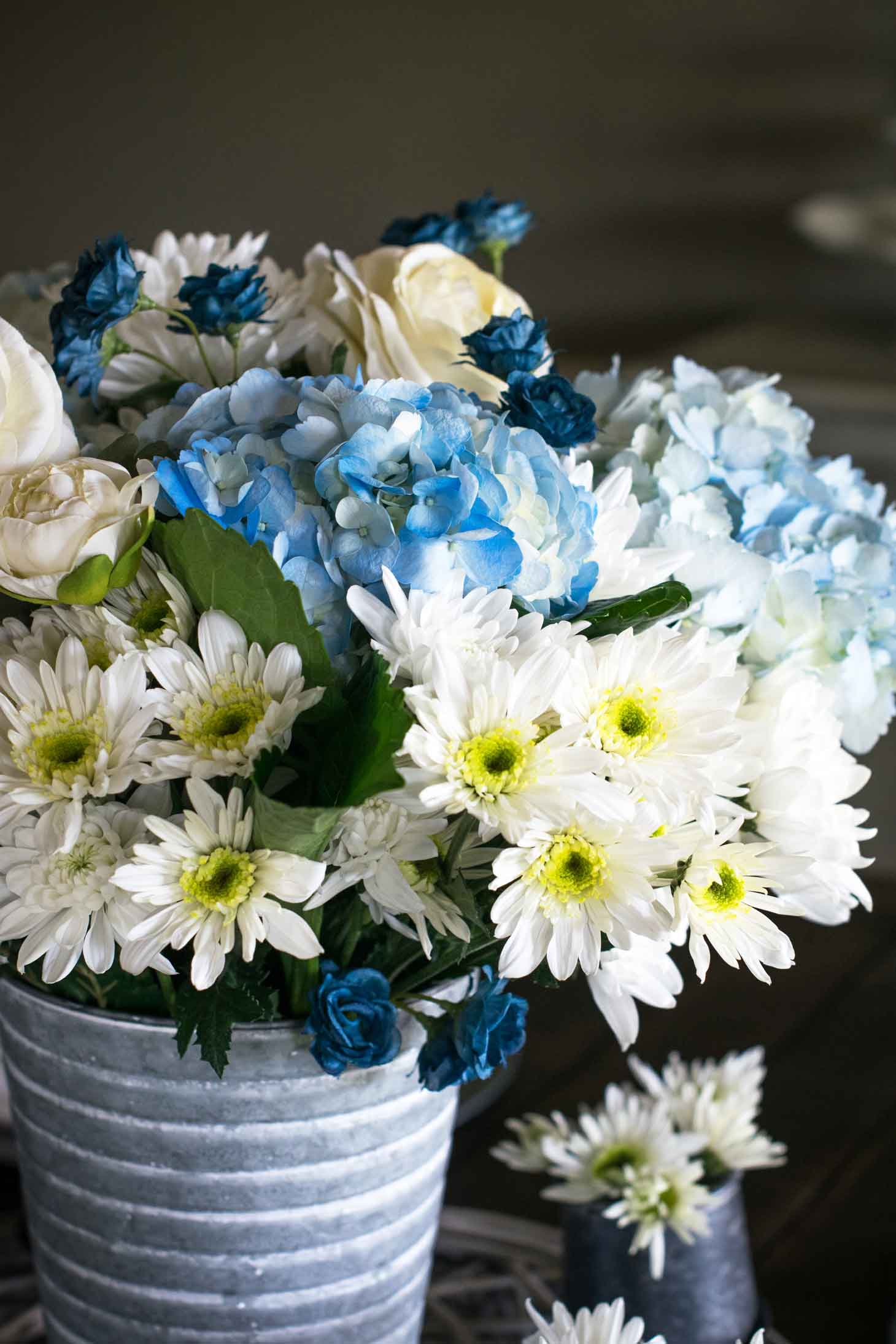 blue and white hydrangea, Euro pops, and more for a spring floral centerpiece