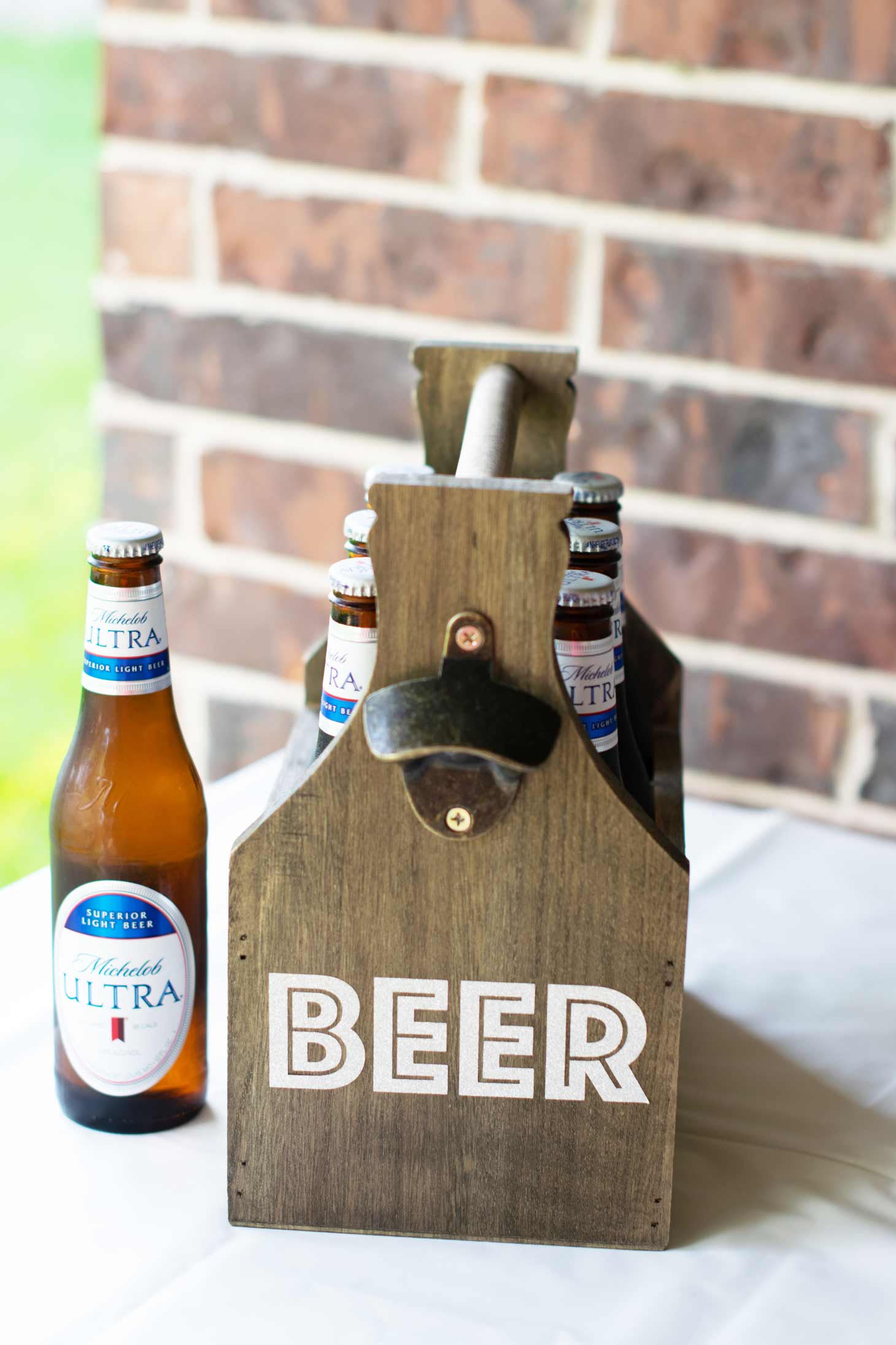 wooden beer holder customized with the word BEER via free SVG.