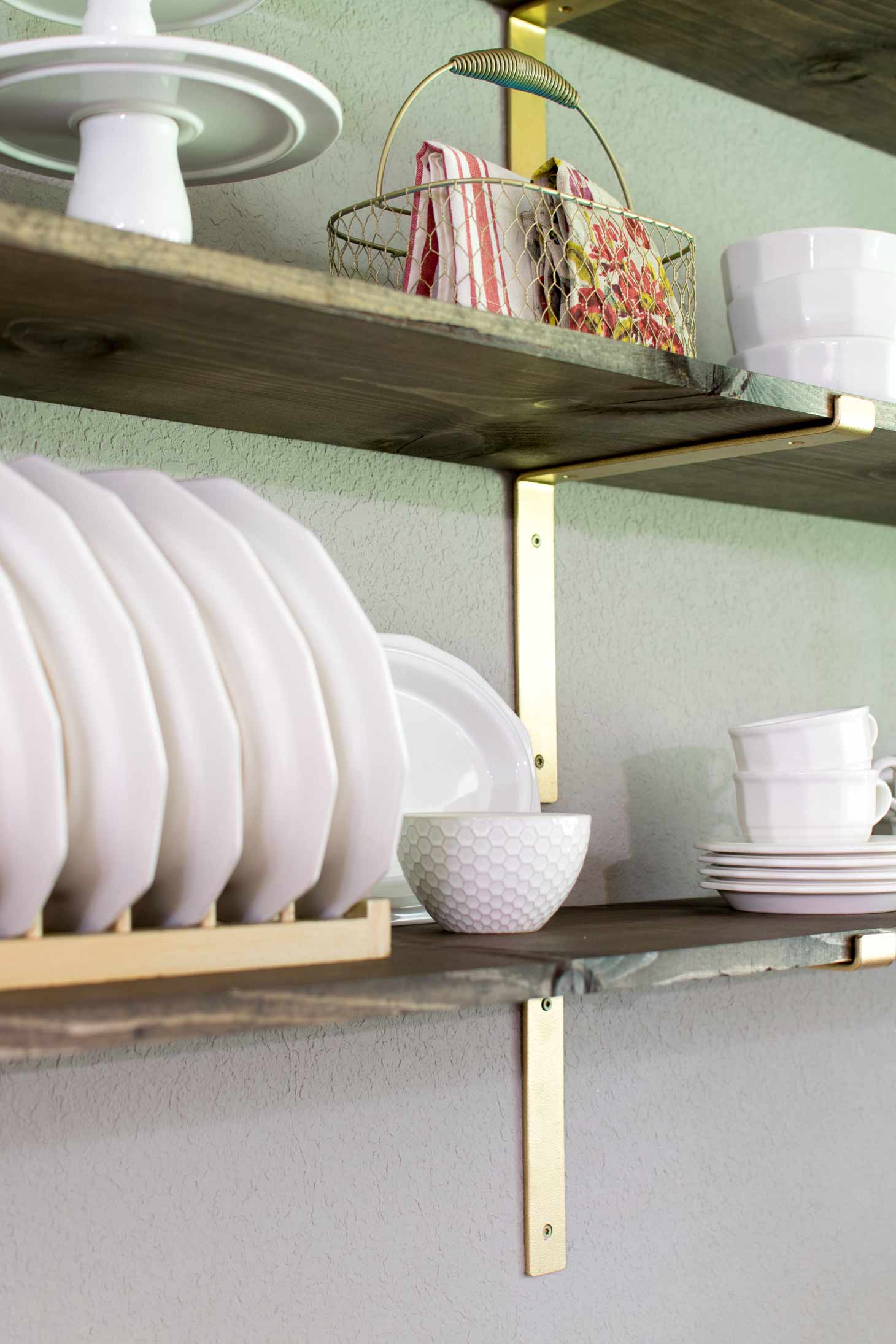 white dishes on rustic shelves in a breakfast room