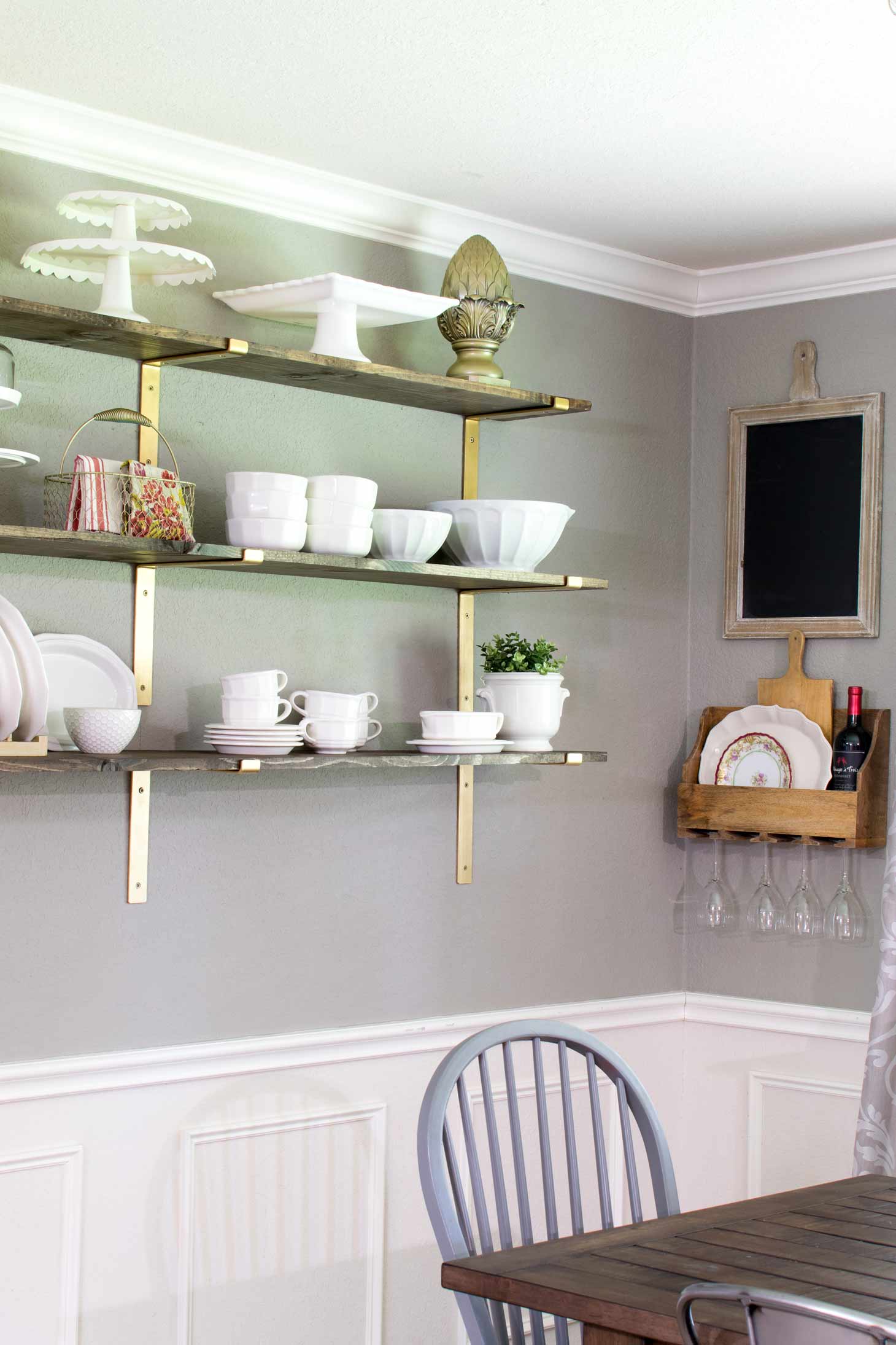 Gold brackets with rustic shelves for a luxury farmhouse feel 