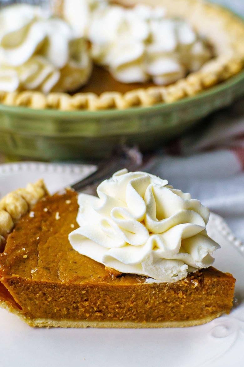 This pumpkin pie recipe uses molasses and is topped with homemade whipped cream frosting