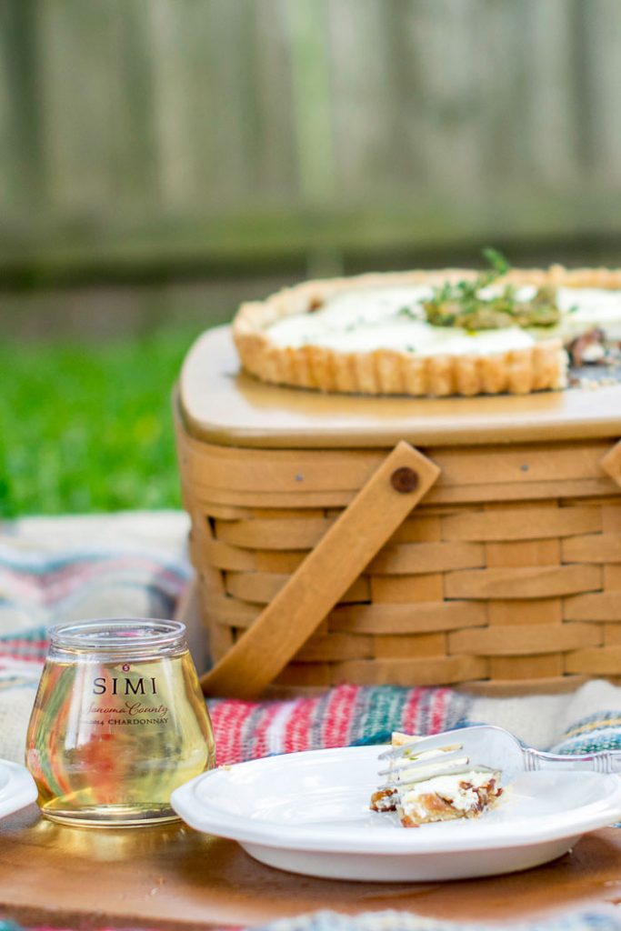 Caramelised onions peek through the bottom of a tart, perfect for an alfresco lunch