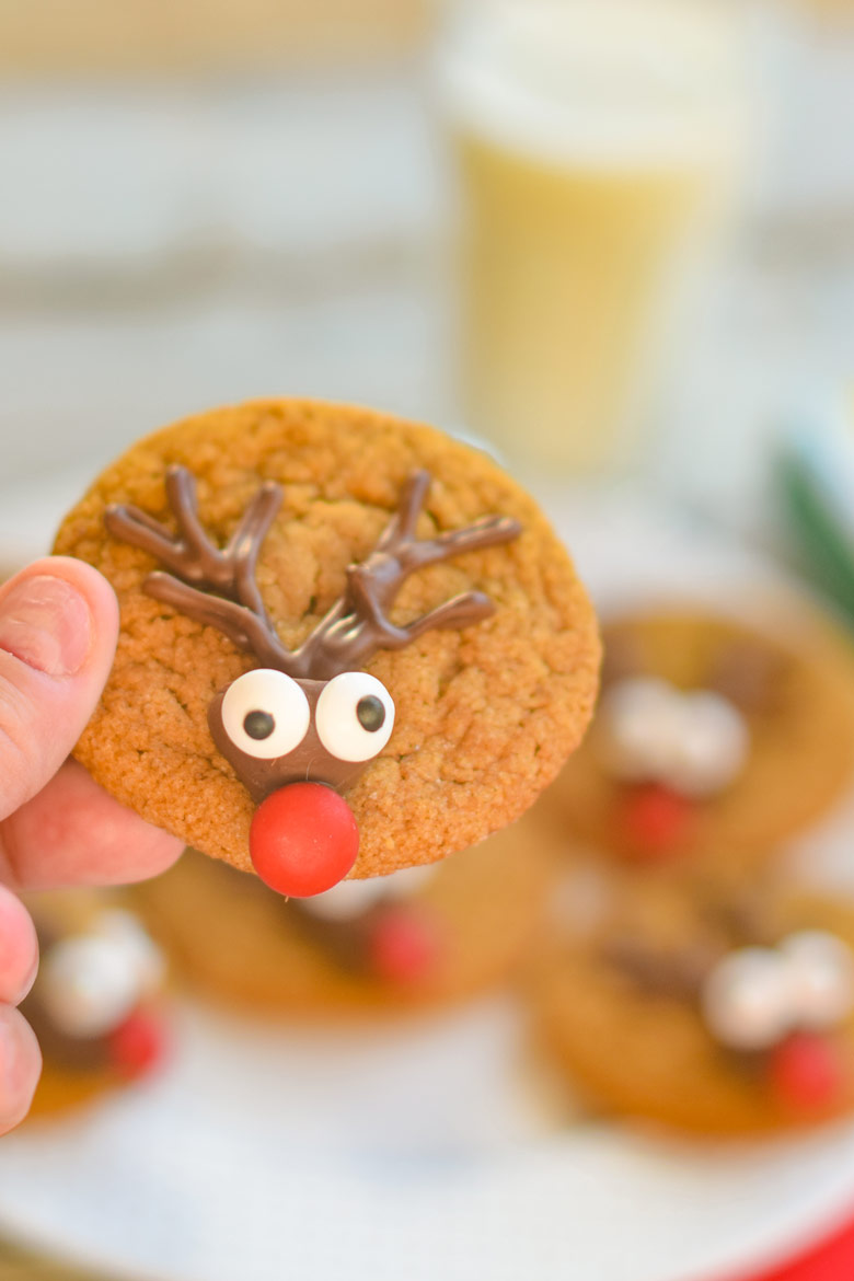 Reindeer cookies are made with a classic gingerbread dough, piped antlers and a candy kiss face.
