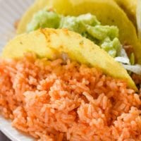 a plate full of mexican rice that is made from scratch