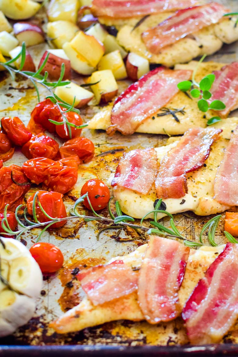 a simple tray bake dinner of bacon chicken and vegetables