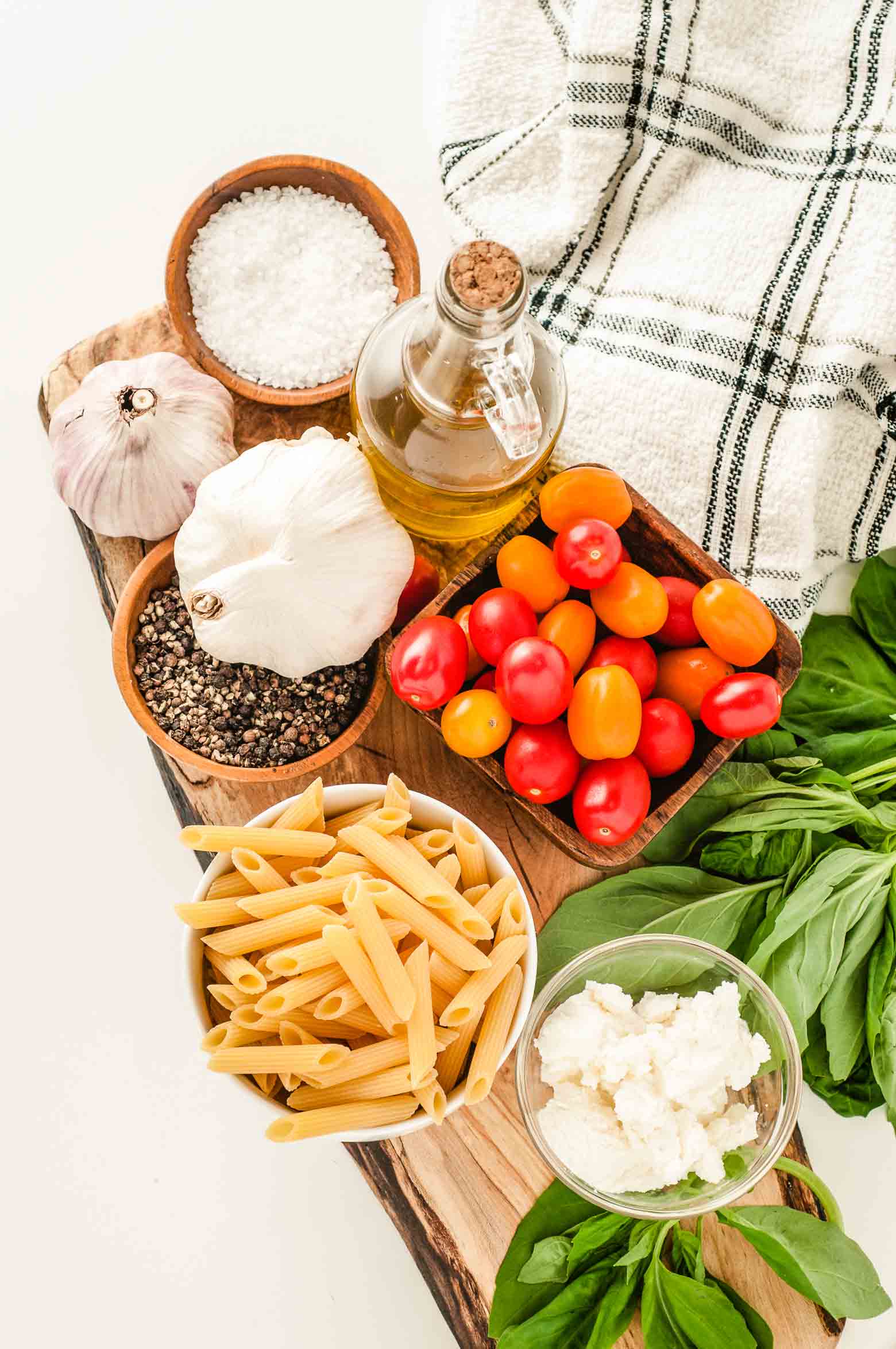 ingredients needed for a basic tomato basil sauce include garlic, salt, pepper, olive oil, noodles, tomatoes, basil and ricotta
