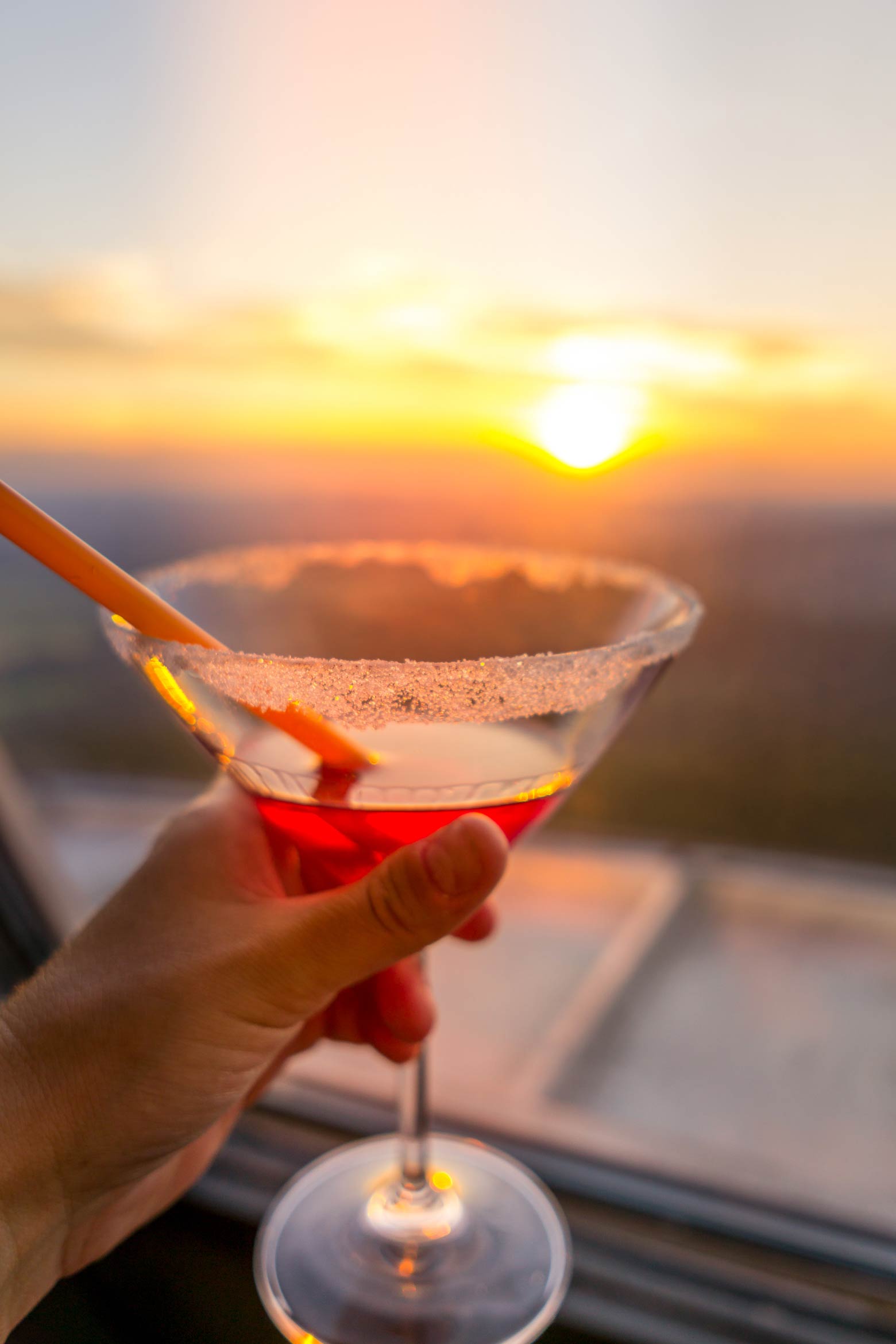 sunset view with a cocktail from the windows