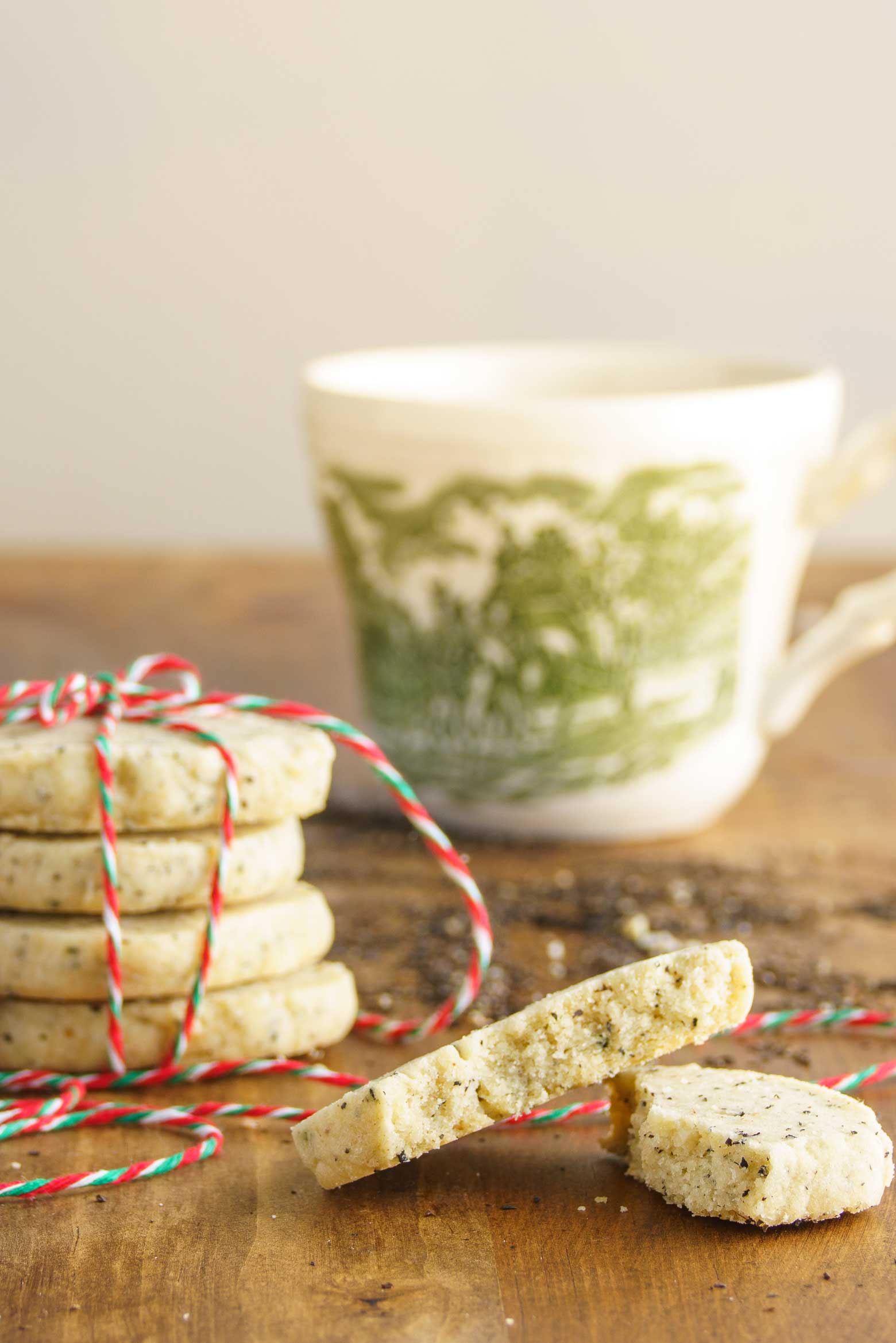 vintage ironstone tea cup with stacked Christmas cookies