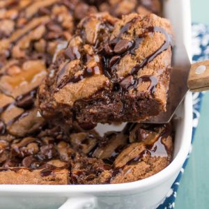 chocolate caramel cookie bar, soft and chewy brownie texture on a spatula