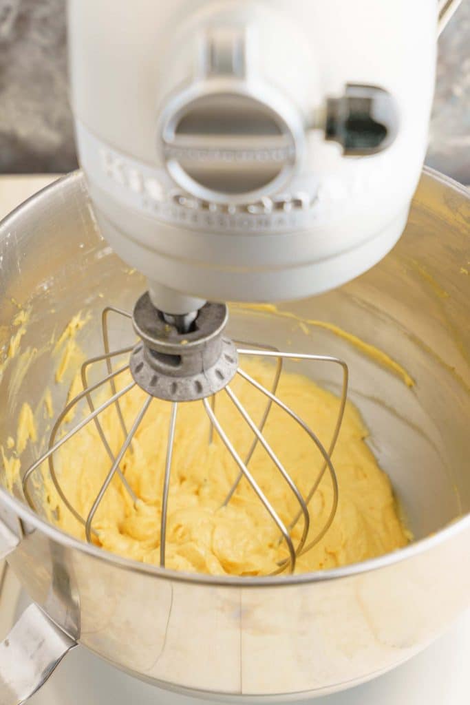 KitchenAid stand mixer mixing pumpkin and powdered sugar