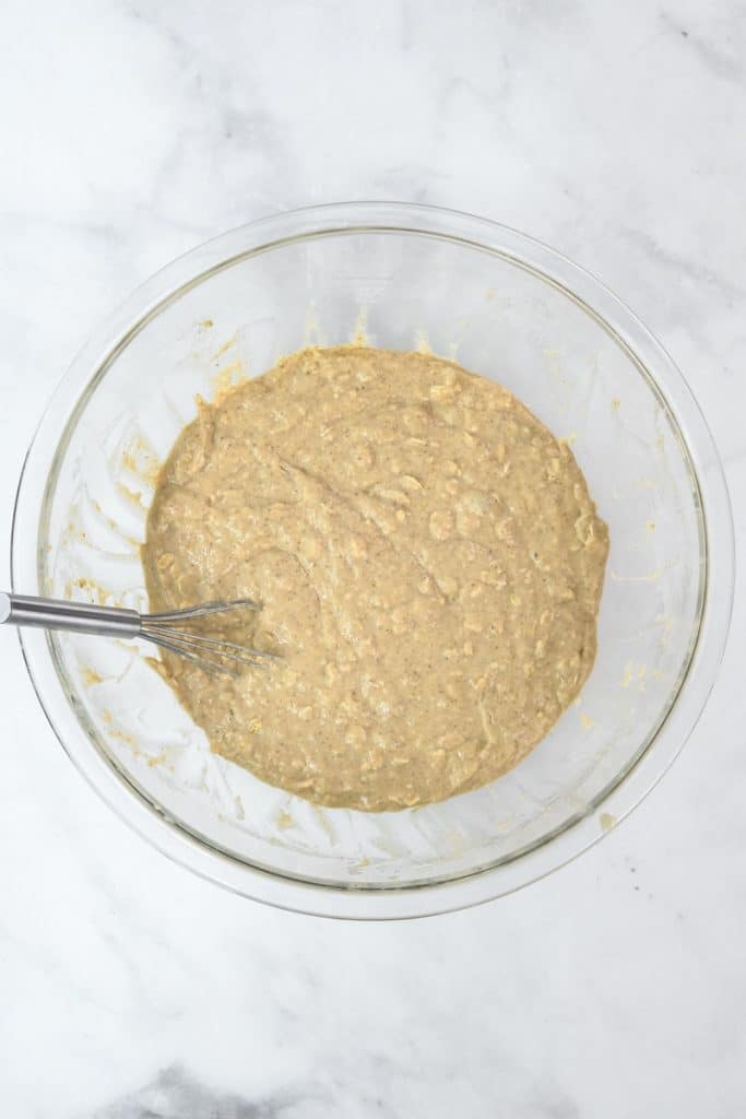 a wet batter after mixing in dry ingredients in a glass bowl