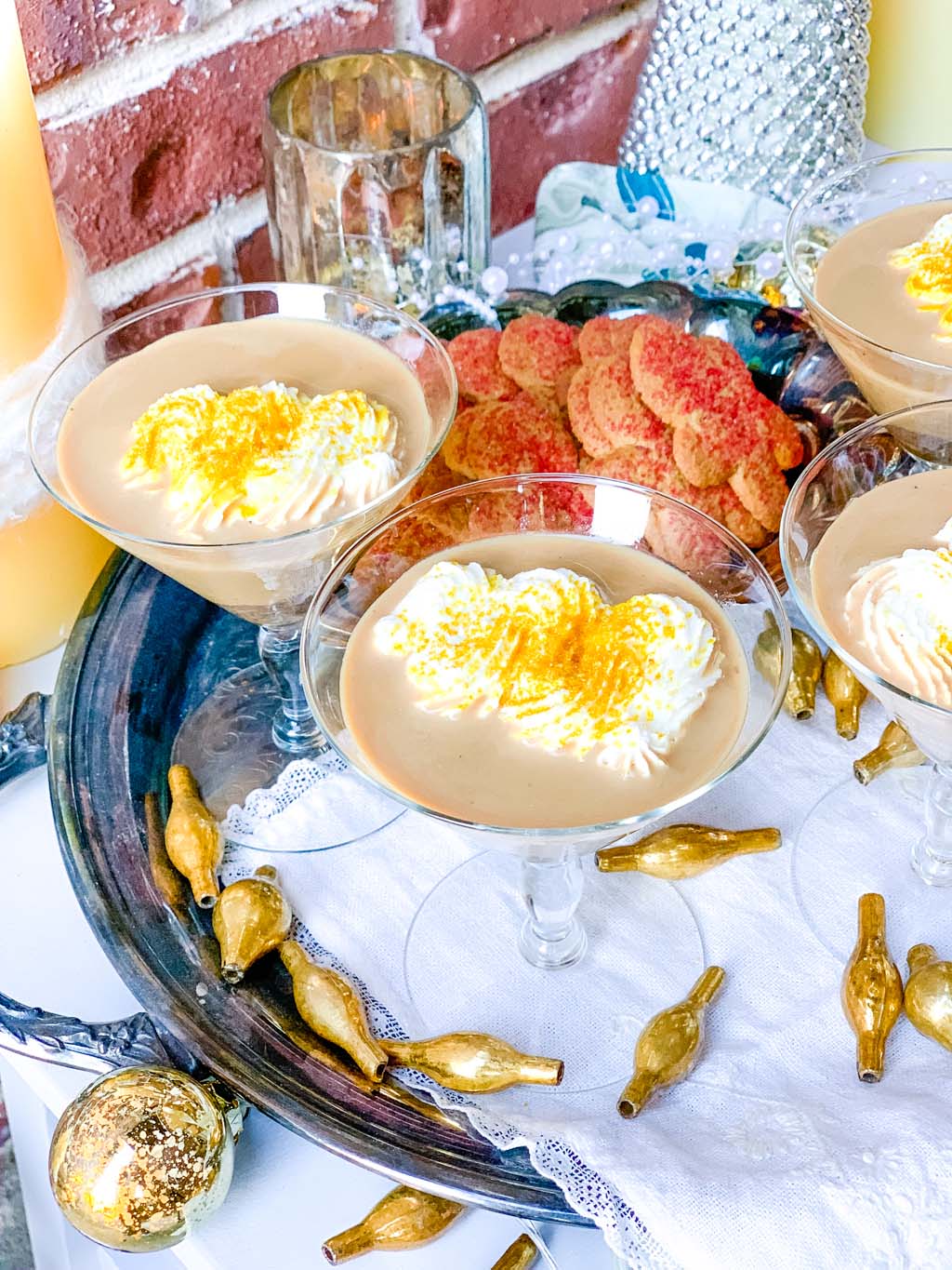 gingerbread cocktails on a silver tray with gold accents
